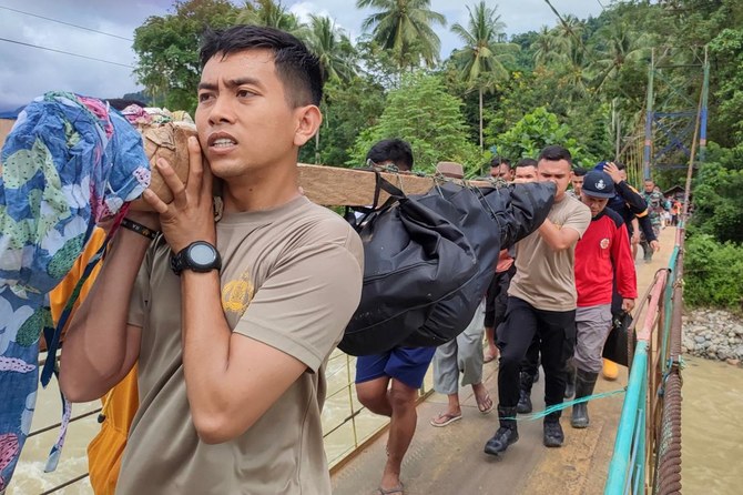 The search intensifies for dozens buried in an Indonesian landslide that killed at least 23 people