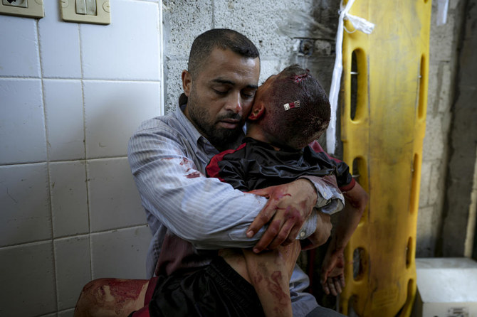 A boy in Gaza was killed by an Israeli airstrike, as his father held him and wouldn’t let go