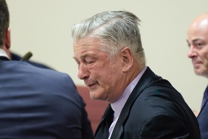 Alec Baldwin weeps in court as judge announces involuntary manslaughter case is dismissed midtrial