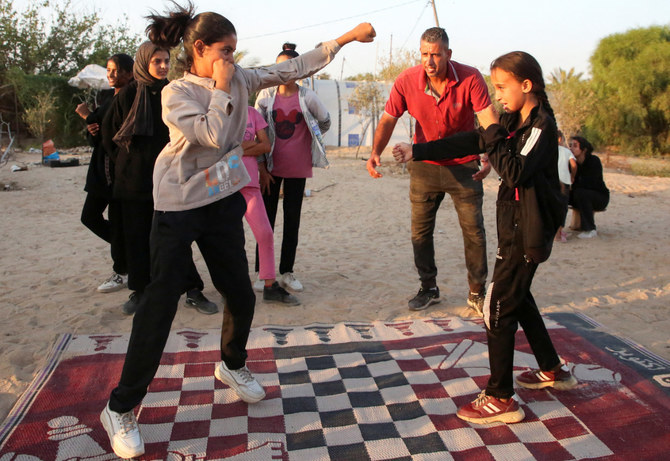 As bombs shatter Gaza, boxing coach emboldens girls