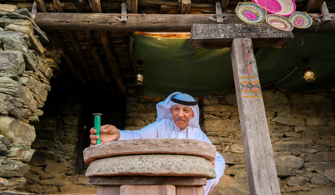 Millstone attracts visitors during Dar Festival at Al-Mousa Heritage Village