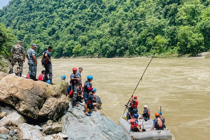 Rescuers in Nepal recover 11 bodies after a landslide swept 2 buses of people into a river