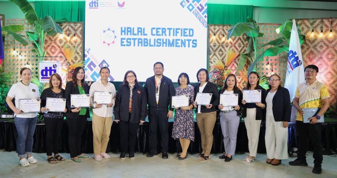 Officials from the Department of Trade and Industry pose with local business owners in Zamboanga City on July 12, 2024. (DTI) 