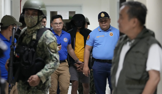 Philippine officials say suspect in the killings of 2 Australians and a Filipino has surrendered