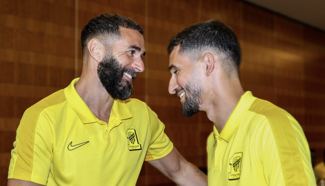 Karim Benzema welcomes Houssem Aouar to Al-Ittihad’s training camp in Alicante, Spain. (X/@ittihad_en)