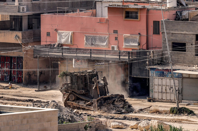 An Israeli army excavator moves during a raid in the Nur Shams camp for Palestinian refugees east of Tulkarm in West Bank. 