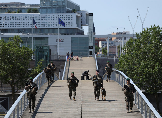 Central Paris locks down for Olympics as athletes arrive