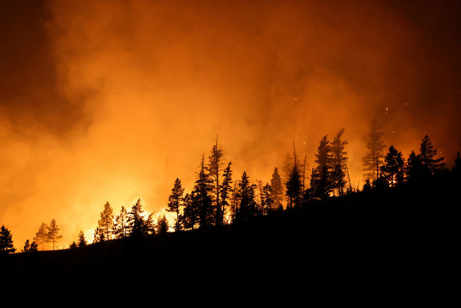 Thousands forced to flee western Canadian town as wildfires approach