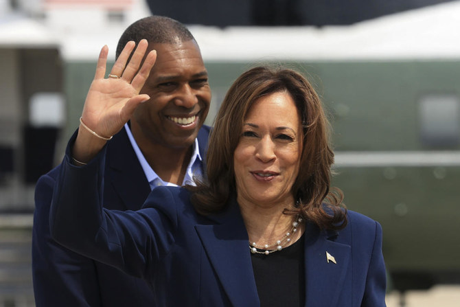 Vice President Kamala Harris waves before boarding Air Force Two as she departs on campaign travel to Milwaukee, Wisc.