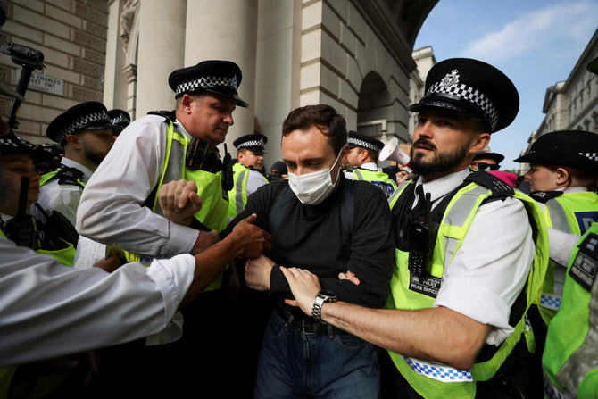 Police officers remove ‘Workers for a Free Palestine’ demonstrators in London.