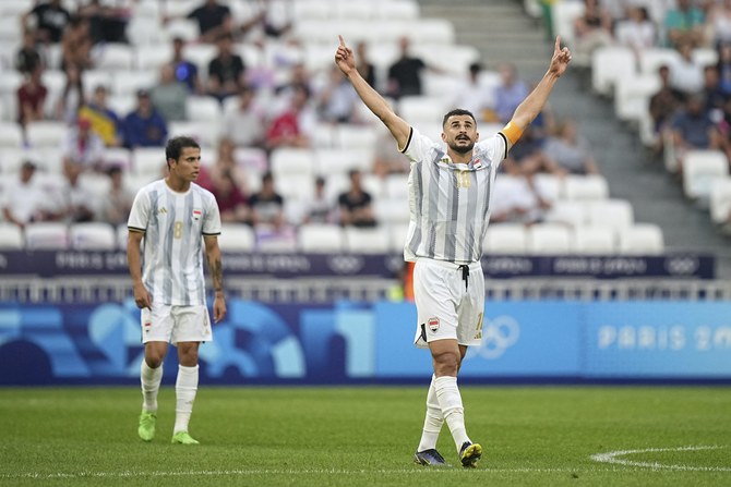 Iraq's Aymen Hussein celebrates after scoring against Ukraine during the 2024 Summer Olympics. AP
