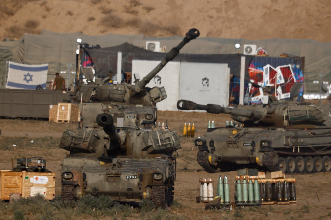Israeli mobile artillery units stand near the Israel-Gaza border, amid the conflict between Israel and Hamas, in Israel, July 25
