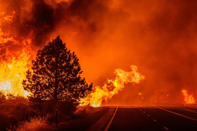 California’s largest wildfire explodes in size as fires rage across US West