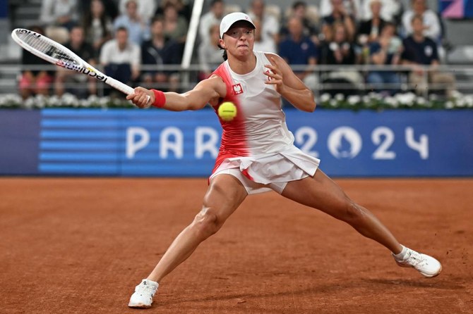 Iga Swiatek starts the 2024 Olympics tennis event with a win at the site of her French Open triumphs