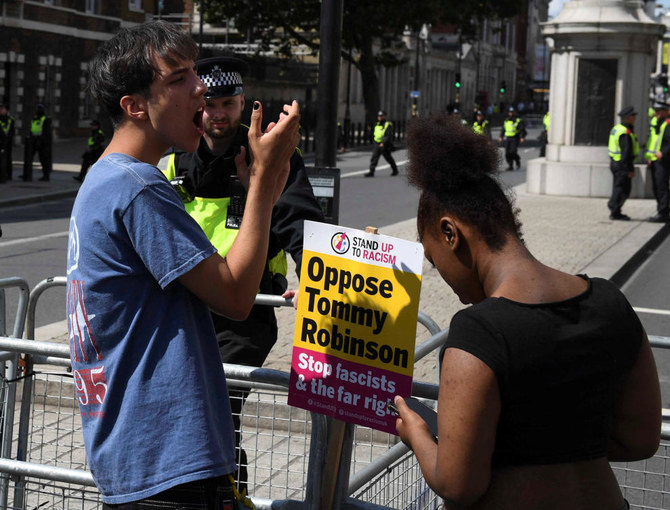 UK police arrest two men after assault on anti-facism protester