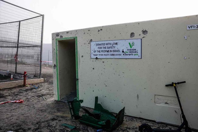 Objects are scattered in front of a shrapnel-poked wall at a sports facility a day after a rocket strike from Lebanon.