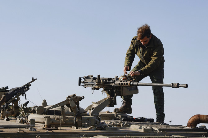 An Israeli soldier checks a weapon at a position in the Israel-annexed Golan Heights near the border with Syria. (File/AFP)