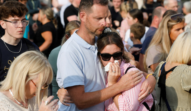 People attend a vigil for the victims of the knife attack in Southport, Britain, July 30, 2024. (REUTERS)
