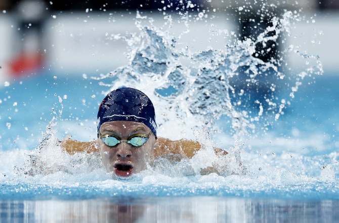 Leon Marchand captures 4th Olympic swimming gold, setting off a party across Paris