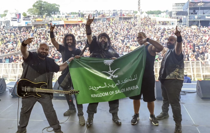 Saudi rockers Wasted Land pose with the Kingdom’s flag at Wacken Open Air 2024. (Supplied)