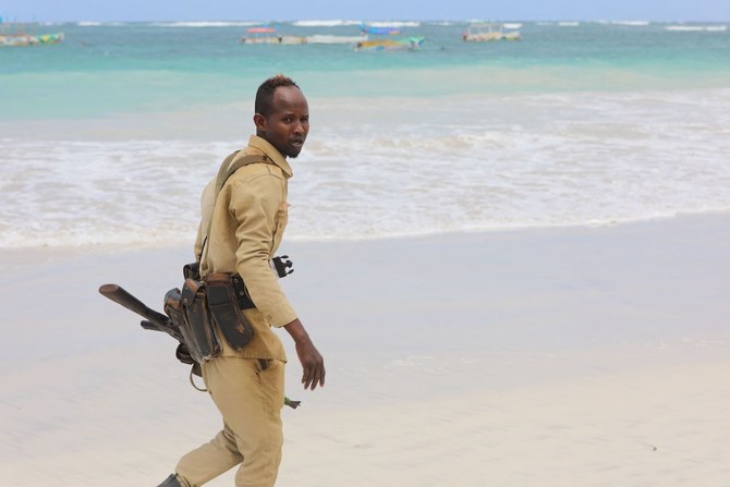 A Somali policeman patrols near the area of an attack in Mogadishu on August 3, 2024. (AFP)