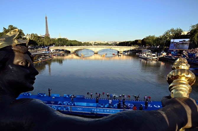 Olympic triathlon mixed relay gets underway with swims in the Seine amid water quality concerns