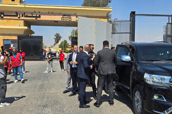 Turkish Foreign Minister Hakan Fidan arrives to the Rafah border crossing between Egypt and the Gaza Strip, in Rafah, Egypt.