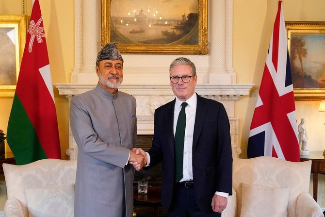 Britain’s PM Keir Starmer shakes hands with Sultan of Oman Haitham bin Tariq during a meeting in London. (AFP)