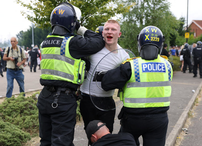 Man jailed for three years for punching police officer in UK anti-Muslim riots