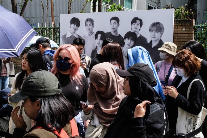 Fans wait to visit a pop-up store of South Korean K-pop sensation BTS entitled “Monochrome” in Seoul on April 26, 2024. (AFP)