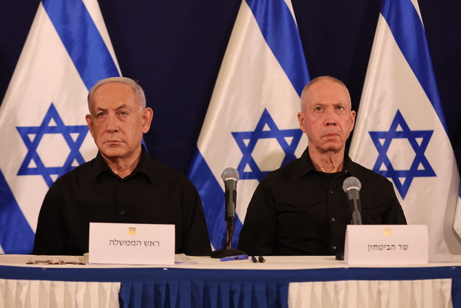 Israeli Prime Minister Benjamin Netanyahu and Defense Minister Yoav Gallant attend a press conference in the Kirya military base