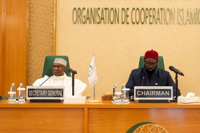 OIC Secretary-General Hissein Brahim Taha and Gambian Foreign Minister Mamadou Tangara attend the OIC summit on Wednesday. (OIC)