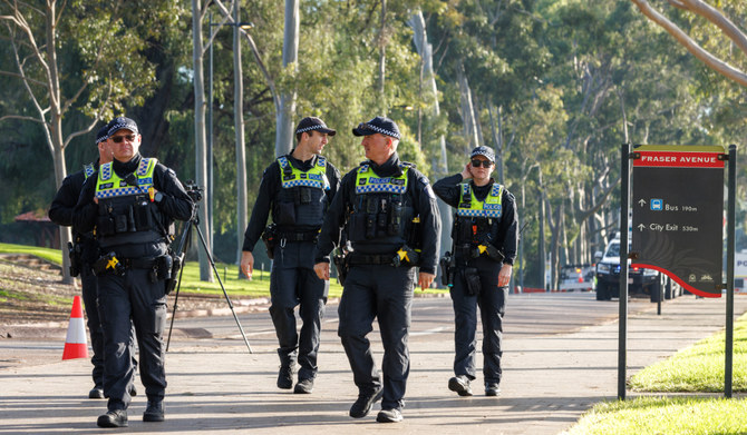 Police officers walk in Kings Park in Perth on June 18, 2024. (AFP)