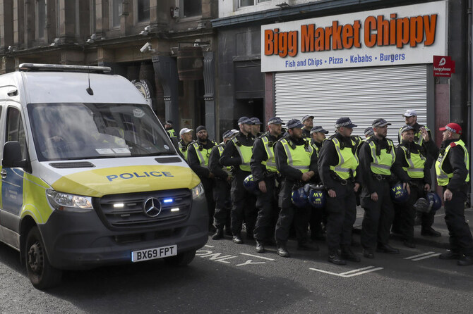 Police forces with riot gear prepare for a far-right anti-immigration protest in Newcastle, England, Saturday, Aug. 10, 2024.(AP