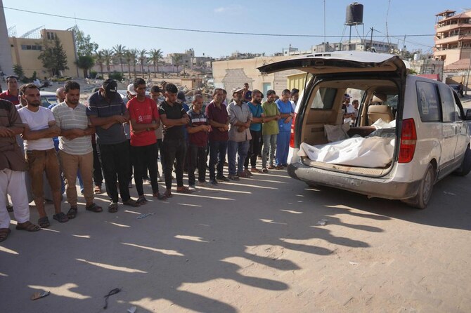 Palestinians attend the funeral of members of the Najjar family, killed in an Israeli strike, in Khan Yunis in southern Gaza.