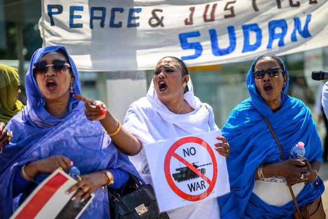 Women shout slogans as they take part in a demonstration on the opening day of Sudan ceasefire talks in Geneva, on August 14.