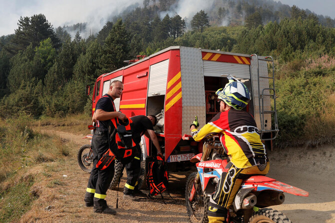 Kosovo man braves wildfires on motorbike to deliver water to firefighters