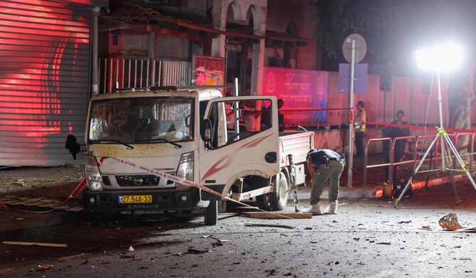 Israeli security and emergency personnel deploy at the site of an explosion in Tel Aviv on August 18, 2024. (AFP)