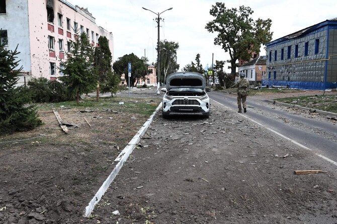 A Ukrainian soldier walks on a damaged street in the Ukrainian-controlled Russian town of Sudzha, Kursk region.