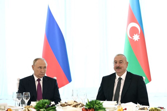 Russia’s President Vladimir Putin and Azerbaijan’s President Ilham Aliyev attend an official dinner following their talks.