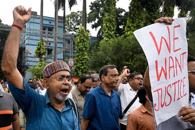 Medical professionals shout slogans during a protest to condemn the rape and murder of a doctor, at the Calcutta Medical College