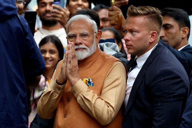 India’s Prime Minister Narendra Modi arrives for a wreath laying ceremony at the Monument to the Good Maharaja.