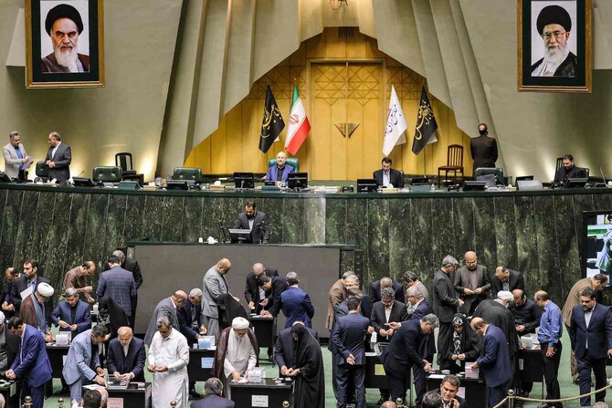 Members of the Iranian parliament vote on the cabinet appointments proposed by the newly-elected president in Tehran.