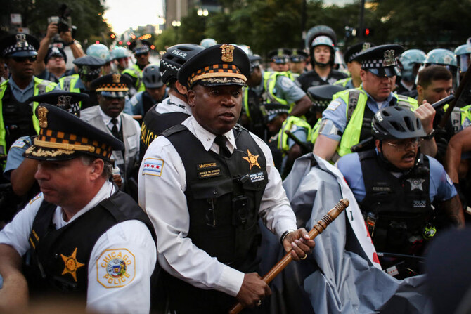 Police clash with demonstrators during a protest at the Israeli consulate during the Democratic National Convention on August 20