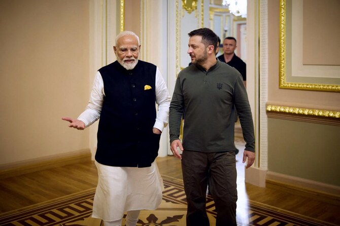 Ukraine’s President Volodymyr Zelensky speakS with Indian Prime Minister Narendra Modi at the Mariinskyi Palace.