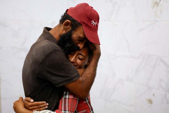 Mourners react during the funeral of Palestinians killed in Israeli strikes at Nasser hospital, in Khan Younis.