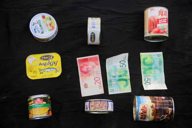 Canned products are displayed with 120 NIS ($32.81) illustrating how much they are worth in the local market in north Gaza.