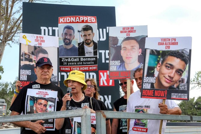 Relatives of Israeli hostage Edan Alexander speak during a demonstration near Kibbutz Nirim in southern Israel.