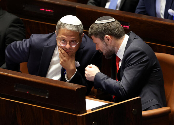 Israeli right wing Knesset members Itamar ben Gvir (L) and Bezalel Smotrich (R) chat at the Knesset in Jerusalem. (File/AFP)