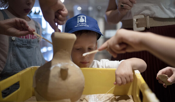 An Israeli boy who broke an ancient jar learns how the museum is piecing it back together